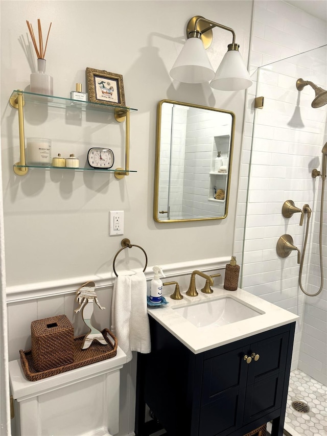 bathroom with vanity and tiled shower