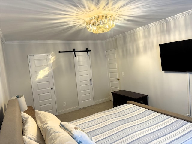 bedroom featuring ornamental molding, a closet, carpet floors, a barn door, and a notable chandelier