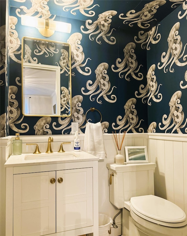 half bathroom featuring toilet and vanity