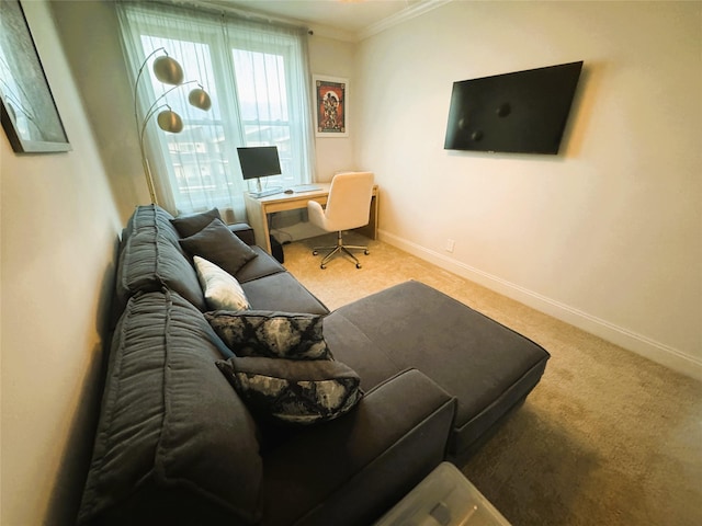 carpeted living room featuring crown molding and baseboards