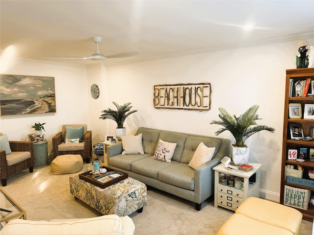 living area with carpet, ceiling fan, and crown molding