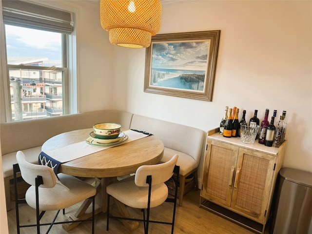dining space with wood finished floors
