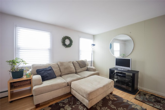 living room featuring light hardwood / wood-style flooring and a healthy amount of sunlight