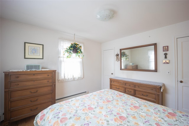 bedroom featuring a baseboard heating unit