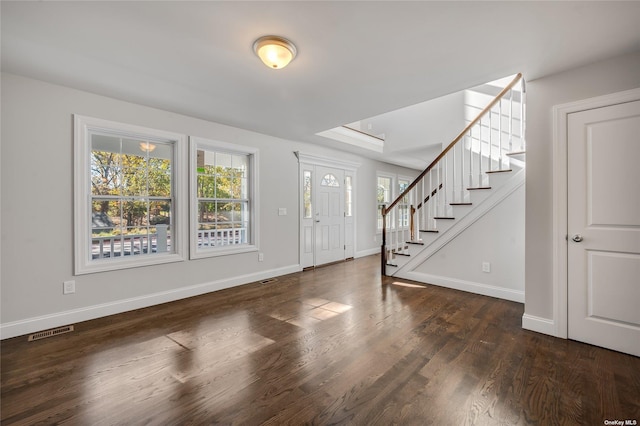 foyer with dark wood-type flooring