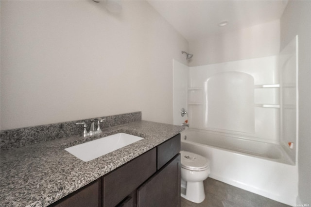 bathroom featuring vanity, toilet, washtub / shower combination, and tile patterned flooring