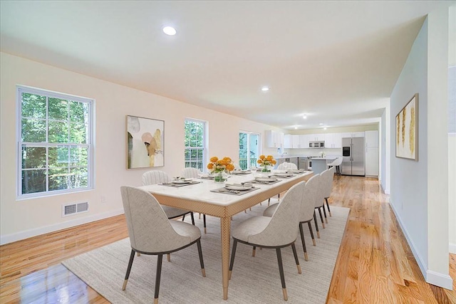 dining room with light hardwood / wood-style floors