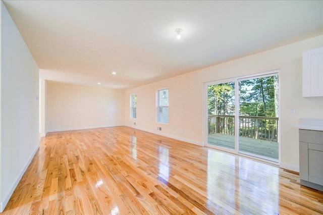 unfurnished living room featuring light hardwood / wood-style flooring