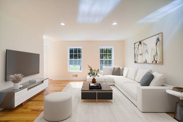 living room with light hardwood / wood-style floors