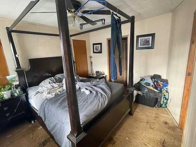 bedroom featuring hardwood / wood-style floors and ceiling fan