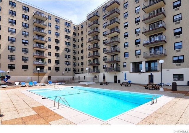 view of swimming pool featuring a patio