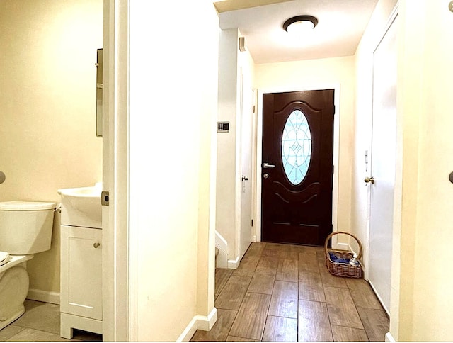 doorway with light wood-type flooring