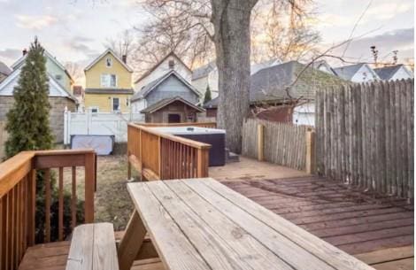 deck with a hot tub