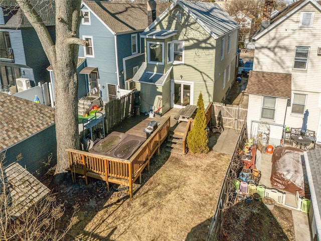 rear view of house featuring a deck