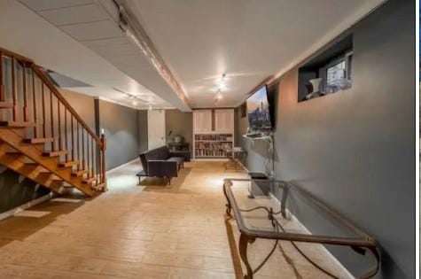 basement featuring light hardwood / wood-style flooring