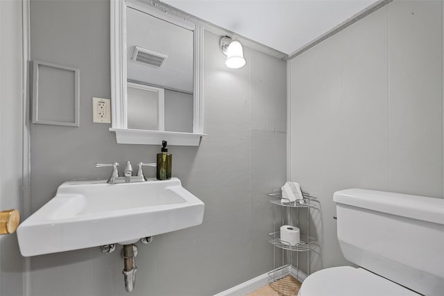 bathroom with toilet and sink