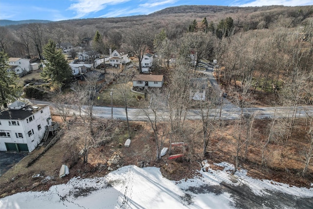 snowy aerial view featuring a mountain view