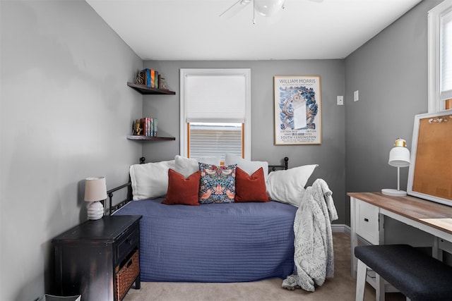 bedroom with light carpet and ceiling fan