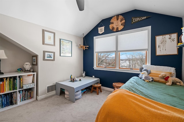 bedroom with ceiling fan, carpet floors, and vaulted ceiling