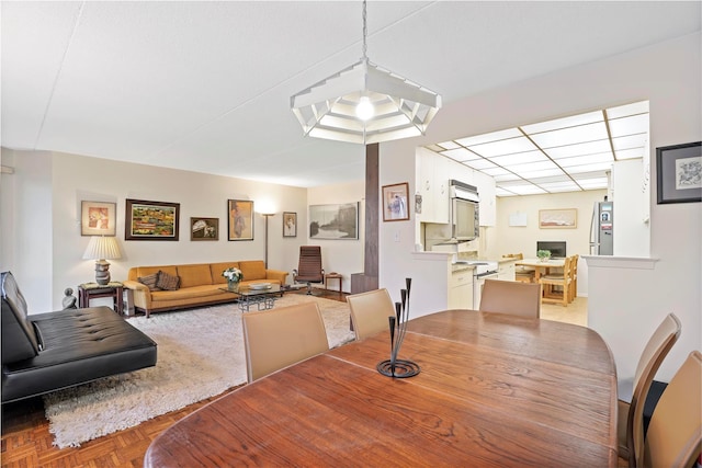 dining space with light parquet floors