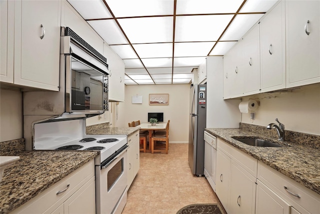 kitchen with sink, white cabinetry, and stainless steel appliances