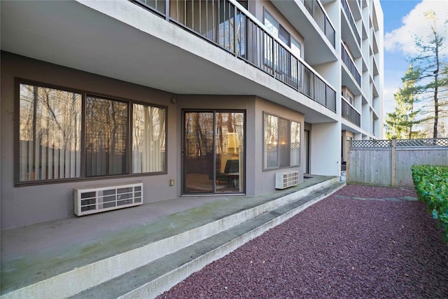 entrance to property featuring a wall mounted AC