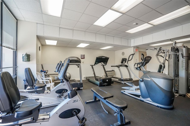 workout area featuring a paneled ceiling