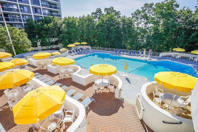 view of swimming pool featuring a patio area