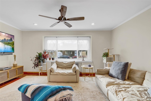 living room with ceiling fan and crown molding