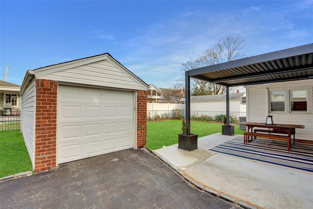 garage with a lawn and cooling unit