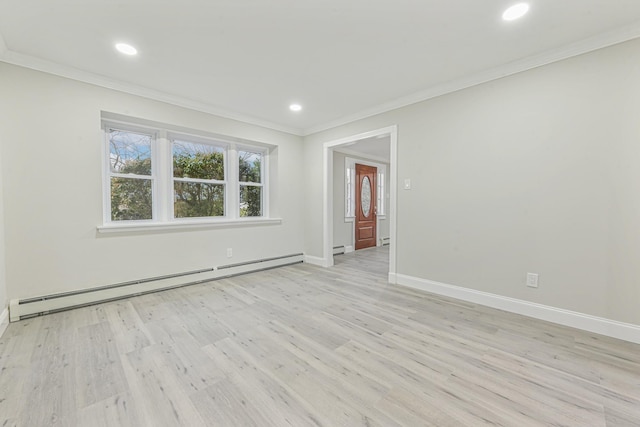 empty room with light hardwood / wood-style floors, ornamental molding, and a baseboard radiator