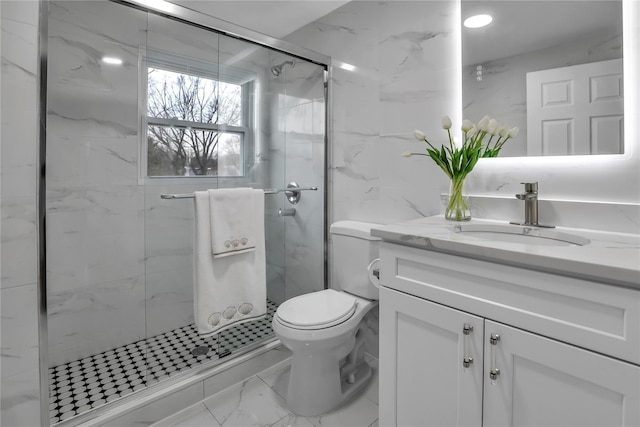 bathroom featuring vanity, an enclosed shower, tile walls, and toilet