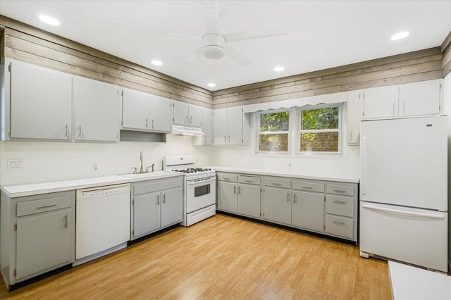 kitchen with gray cabinetry, ceiling fan, sink, light hardwood / wood-style flooring, and white appliances