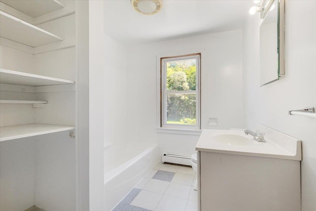 full bathroom with vanity, tile patterned floors, washtub / shower combination, toilet, and a baseboard radiator