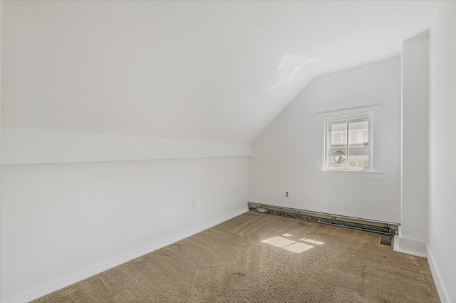 bonus room with carpet floors, baseboard heating, and lofted ceiling