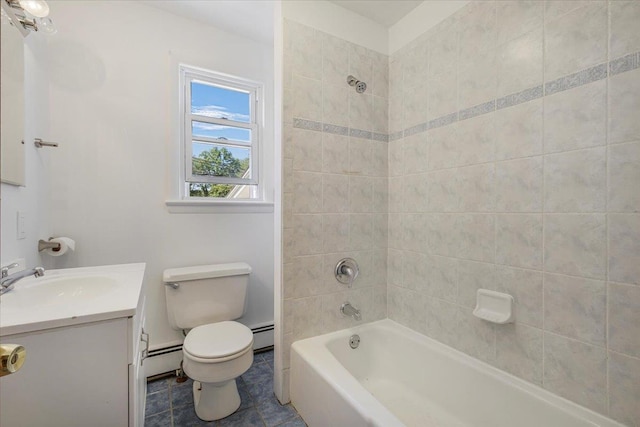 full bathroom featuring baseboard heating, vanity, tiled shower / bath, and toilet