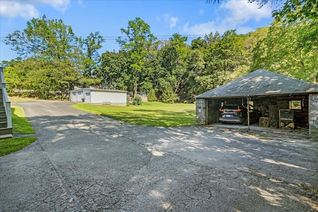 exterior space featuring a carport and a front lawn