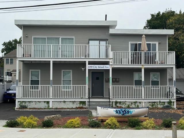 view of front of house featuring a balcony