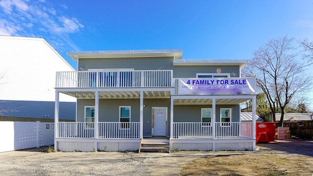 view of front of home featuring a balcony and a porch