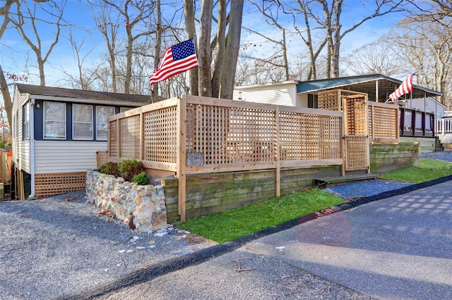 view of property exterior featuring a deck