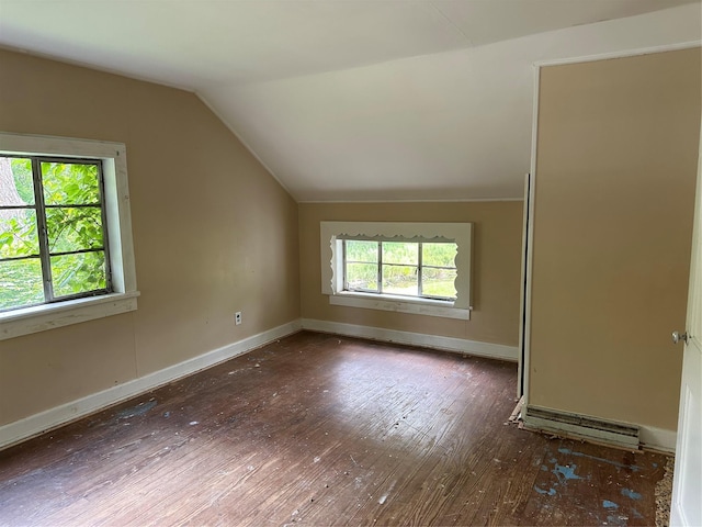 bonus room featuring dark wood-type flooring and lofted ceiling