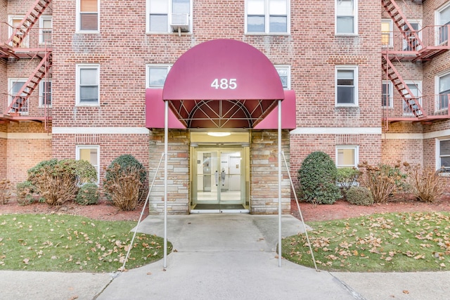 view of exterior entry featuring french doors