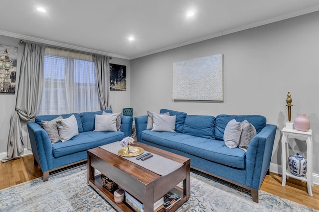 living room with crown molding and hardwood / wood-style flooring