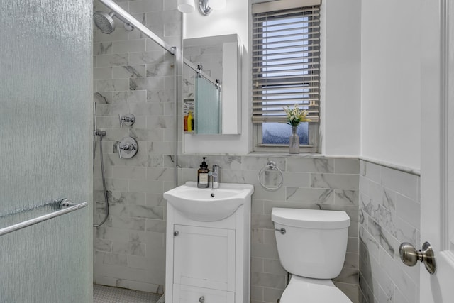 bathroom with toilet, tile walls, walk in shower, and vanity