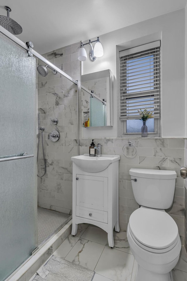 bathroom with toilet, tile walls, walk in shower, and vanity