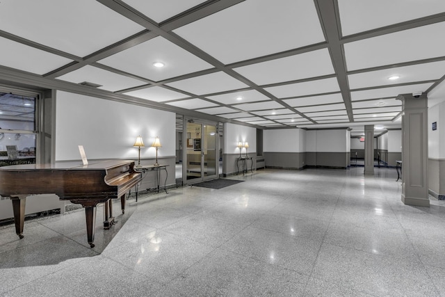 misc room featuring beam ceiling, coffered ceiling, and decorative columns