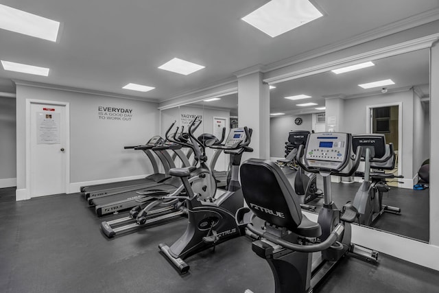 workout area featuring ornamental molding