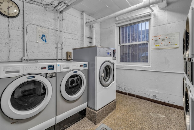 laundry room with washer and dryer and stacked washer / dryer