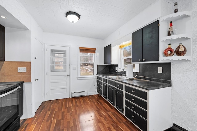 kitchen featuring sink, backsplash, a baseboard heating unit, dark hardwood / wood-style floors, and range with electric stovetop