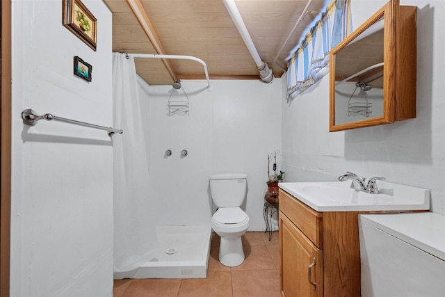 bathroom featuring tile patterned flooring, toilet, vanity, and a shower with shower curtain